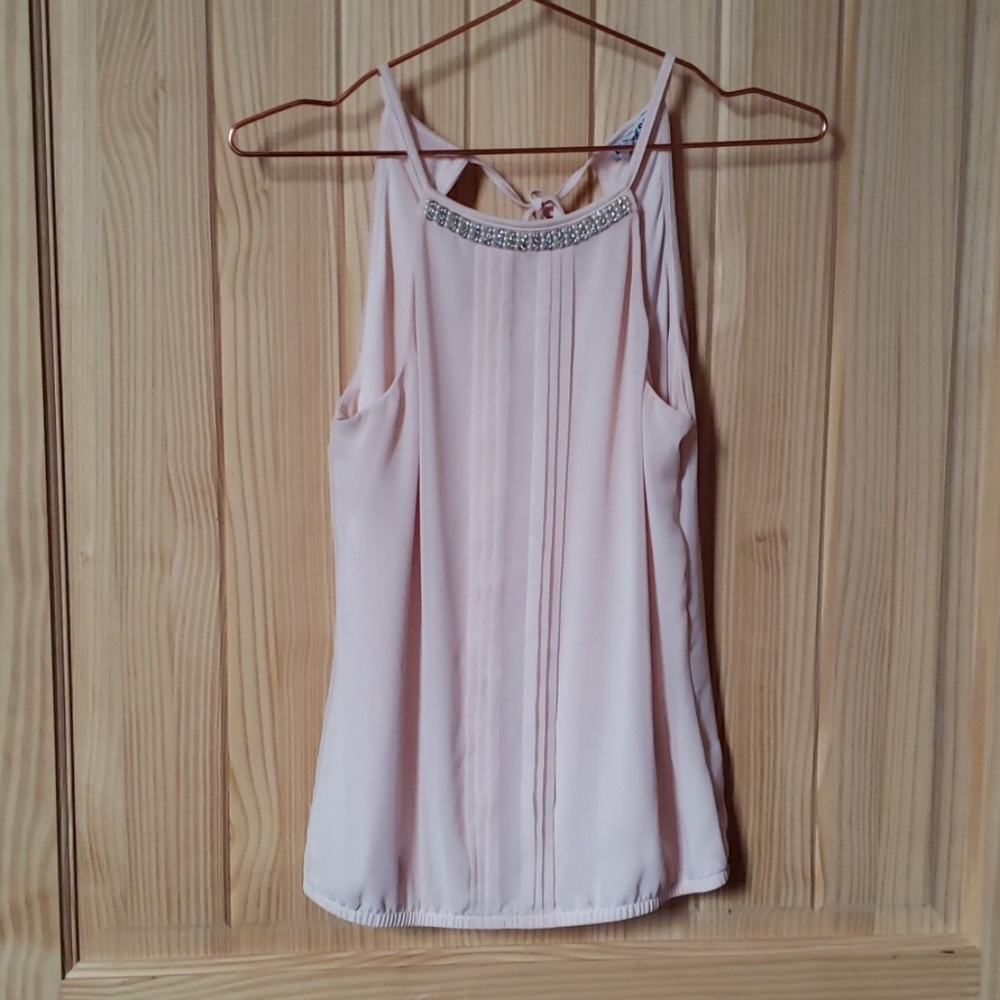 Express top adorned with pearls and gems